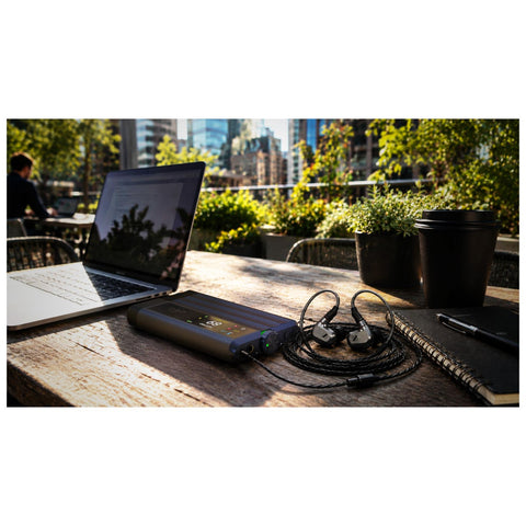 iFi Audio iDSD GR 2 Portable DAC, Preamp, and Headphone Amp outside with sennheiser (view 6 of 7)