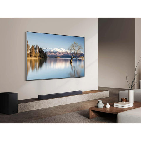 Samsung Q-Series 3.1.2 Channel Soundbar with Subwoofer (HW-Q600F) lifestyle with tv (view 5 of 5)