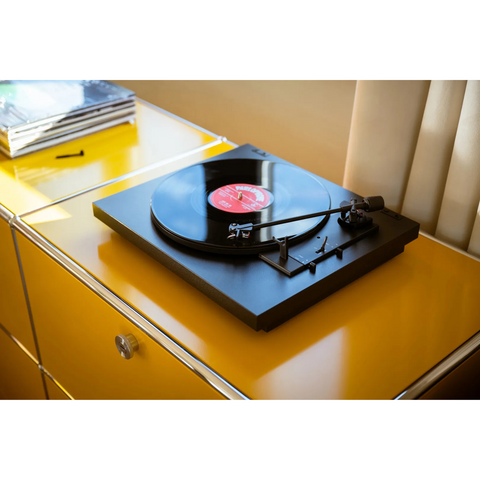 Pro-Ject Automat A1.2 - lifestyle on orange  dresser cabinet (view 4 of 5)