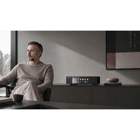 Eversolo T10 Streaming Transport with man sitting  (view 6 of 6)