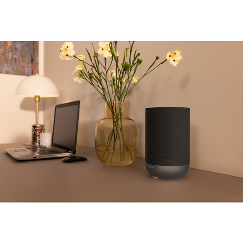 Denon Home 200 Wireless Smart Speaker next to laptop (view 6 of 6)