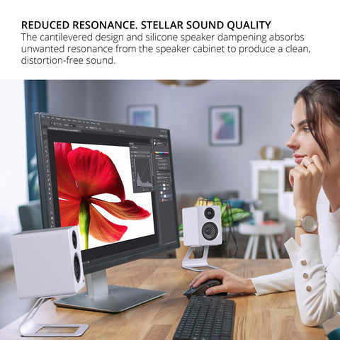Kanto SE2 White Stands - Pair Reduced Resonance - Person Using Speakers and Stands at Desk (view 3 of 10)